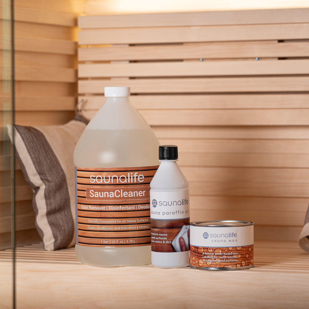 SaunaLife sauna care package products on a sauna bench