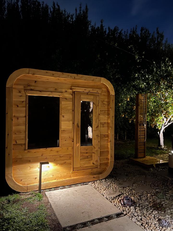 Dundalk CT Luna 4-Person Outdoor Sauna lit up at night
