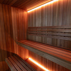 Corner benches and LED lighting inside the Dundalk Leisurecraft Element Studio 4 Person Traditional Indoor Sauna
