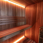 Benches with LED lighting inside the Dundalk Leisurecraft Element Studio 4 Person Traditional Indoor Sauna
