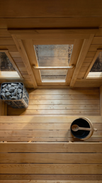 Interior floor and heater of the Dundalk CT Palmer 4-Person Outdoor Cabin Sauna seen from above