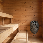 Lower benches and stone heater inside the Dundalk CT Avalon 4-Person Sauna
