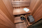 Benches and heater inside the Dundalk Leisurecraft Element Nook 1-2 Person Traditional Indoor Sauna