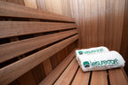 Benches with a folded towel inside the Dundalk Leisurecraft Element Nook 1-2 Person Traditional Indoor Sauna