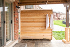 Dundalk CT Luna 4-Person Outdoor Sauna on a covered patio