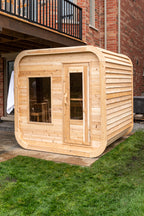 Front view of the Dundalk CT Luna 4-Person Outdoor Sauna with windows on a lawn