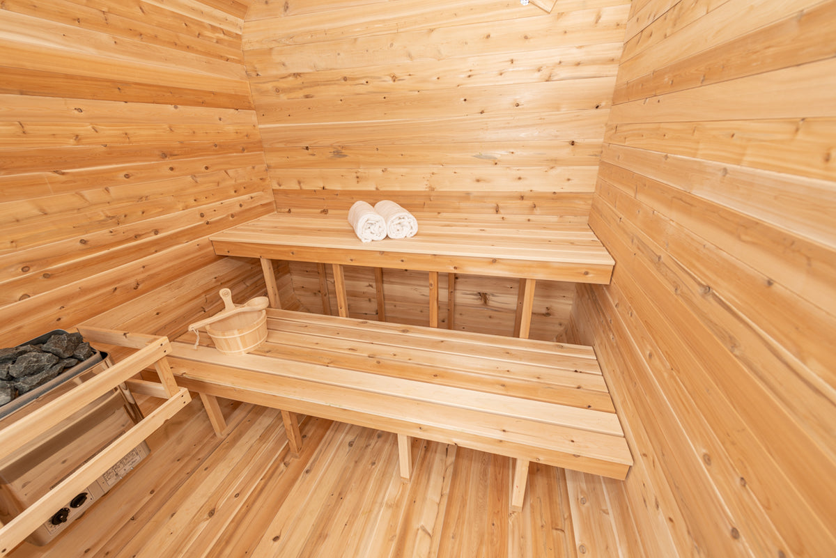 Benches and heater inside the Dundalk CT Luna 4-Person Outdoor Sauna