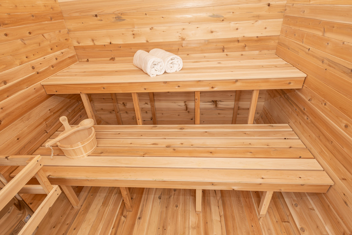 Interior benches with towels inside the Dundalk CT Luna 4-Person Outdoor Sauna