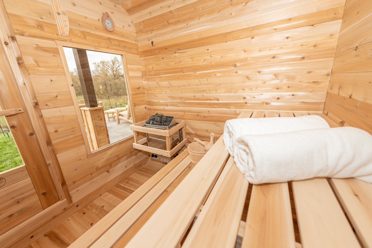 Bench with rolled towel inside the Dundalk CT Luna 4-Person Outdoor Sauna