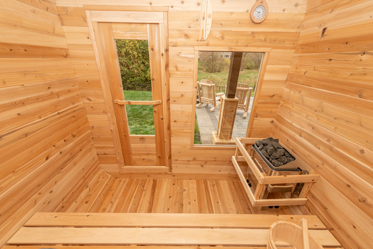 Interior of the Dundalk CT Luna 4-Person Outdoor Sauna with windows and heater