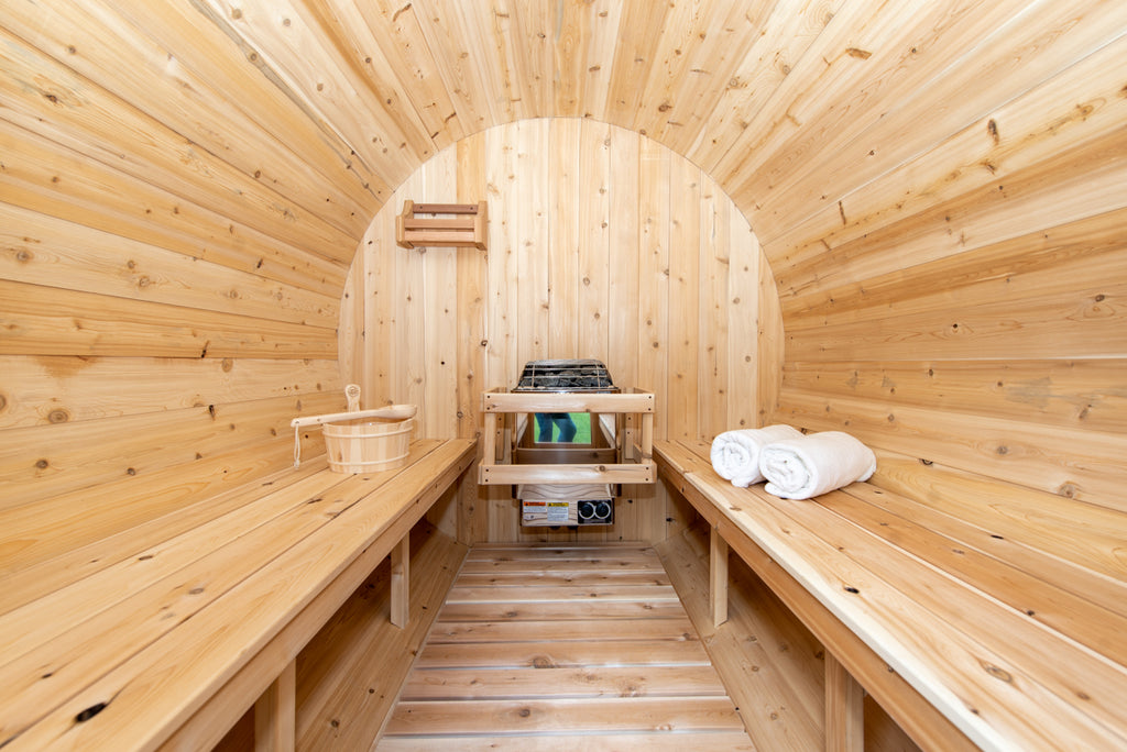 Heater and benches inside the Dundalk CT Harmony 4-Person Outdoor Barrel Sauna