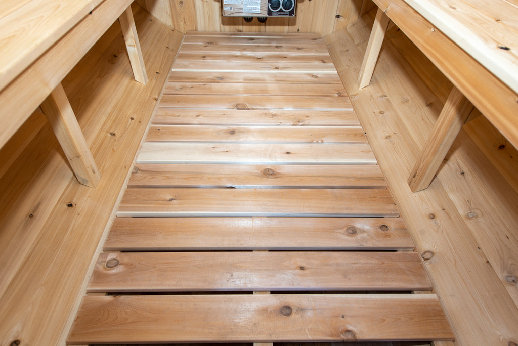 Slatted floor and benches inside the Dundalk CT Harmony 4-Person Outdoor Barrel Sauna