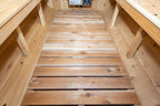 Slatted floor and benches inside the Dundalk CT Harmony 4-Person Outdoor Barrel Sauna
