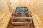 Heater with stones and safety rail inside the Dundalk CT Harmony 4-Person Outdoor Barrel Sauna