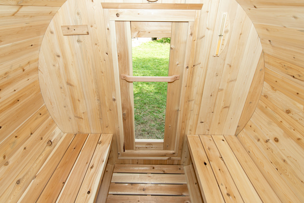 Benches and aisle inside the Dundalk CT Harmony 4-Person Outdoor Barrel Sauna