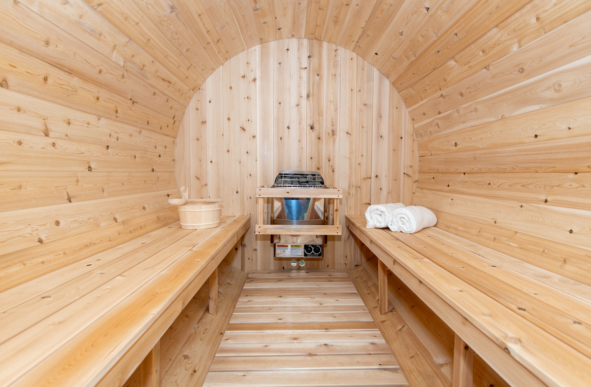 Interior of the Dundalk CT Tranquility 6-Person Outdoor Barrel Sauna with benches and heater