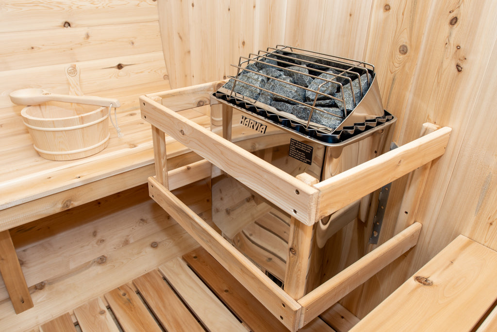 Heater with safety rail inside the Dundalk CT Tranquility 6-Person Outdoor Barrel Sauna