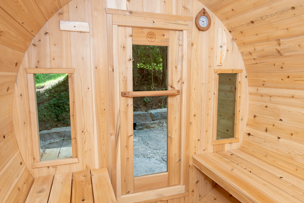 Glass door and windows inside the Dundalk CT Tranquility 6-Person Outdoor Barrel Sauna