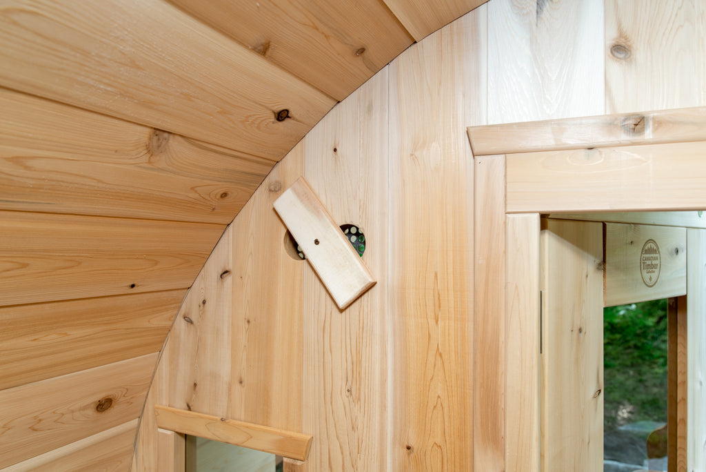 Glass door and curved wall inside the Dundalk CT Tranquility 6-Person Outdoor Barrel Sauna
