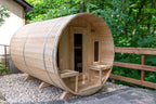 Dundalk CT Tranquility 6-Person Outdoor Barrel Sauna on a deck beside a railing