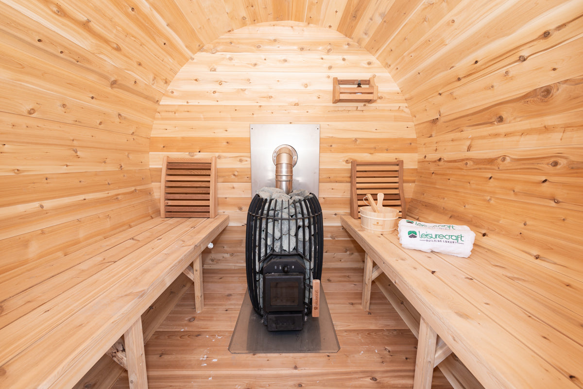 Interior of the Dundalk CT Elation 4-Person Outdoor Barrel Sauna with benches and heater