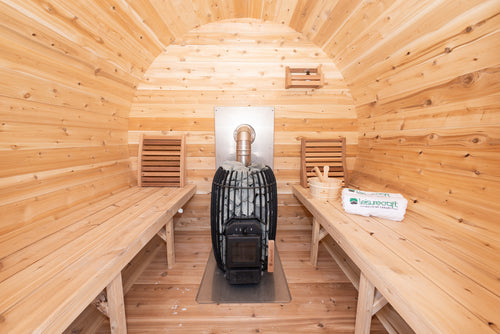 Interior of the Dundalk CT Elation 4-Person Outdoor Barrel Sauna with benches and heater
