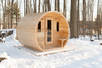 Dundalk CT Elation 4-Person Outdoor Barrel Sauna in a snowy forest