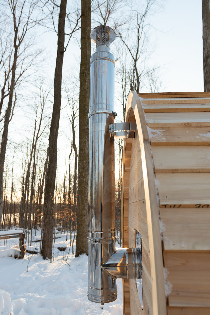 Stove chimney pipe and entry steps on the Dundalk CT Elation 4-Person Outdoor Barrel Sauna