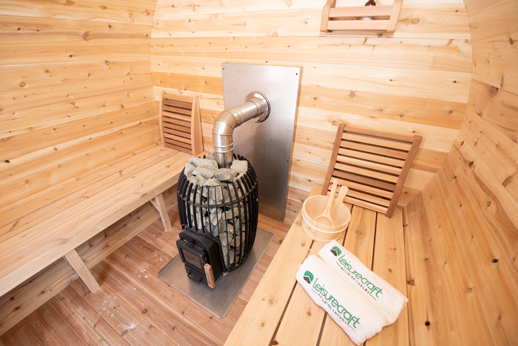 Heater and benches inside the Dundalk CT Elation 4-Person Outdoor Barrel Sauna