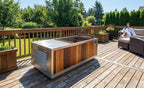 Finnmark SoulCold plunge tub on a wooden deck with a person relaxing nearby