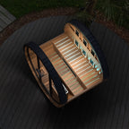 Finnmark FD-6 barrel sauna at night with LED lighting and the door open