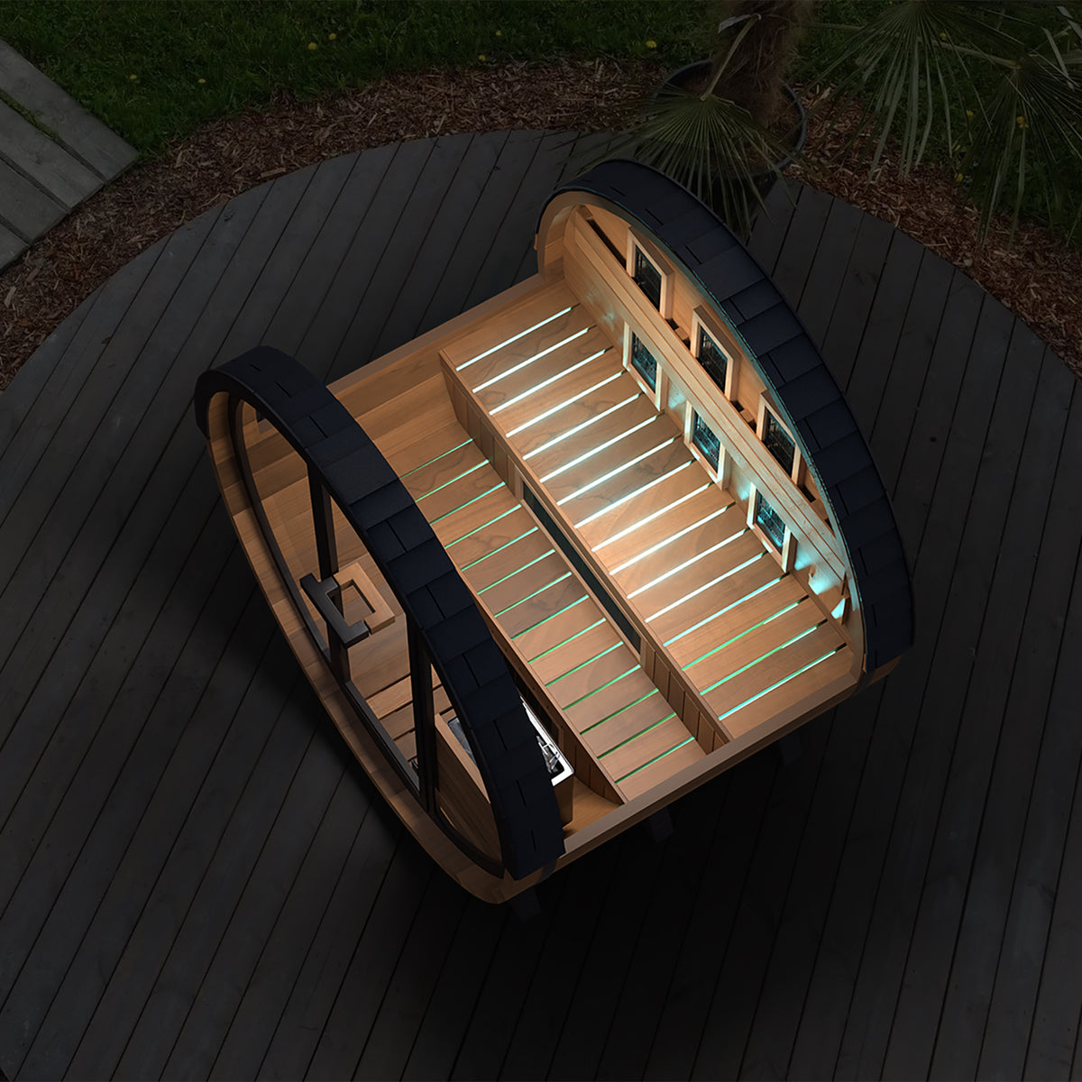 Finnmark FD-6 barrel sauna at night with LED lighting and the door open