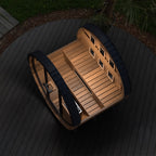 Finnmark FD-6 barrel sauna outdoors at night with the door open