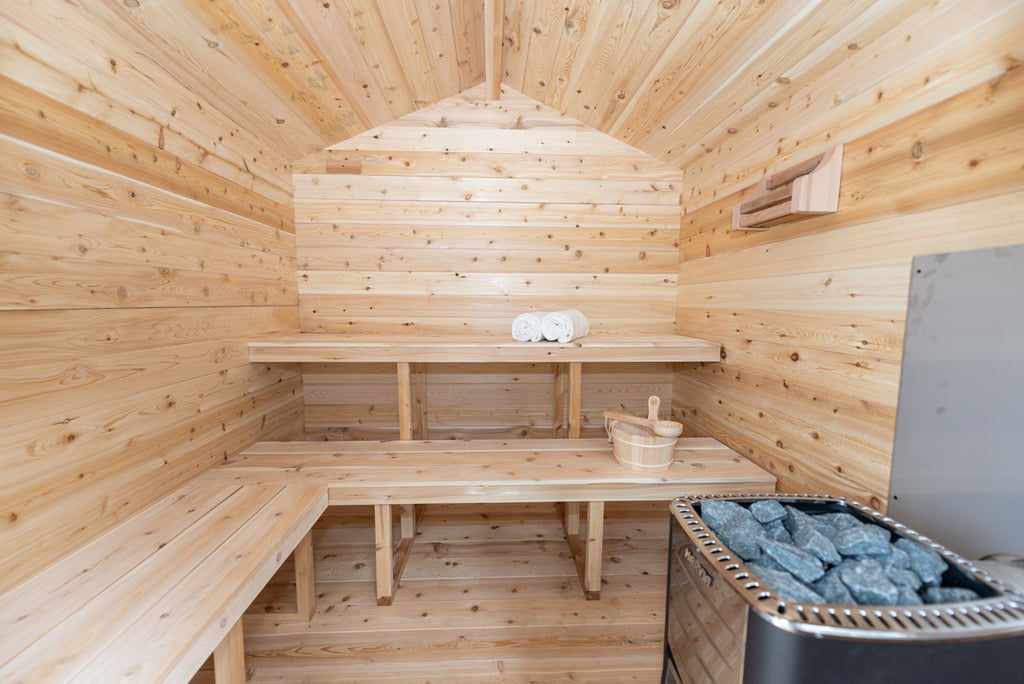 Interior of the Dundalk CT Georgian 6-Person Outdoor Cabin Sauna with benches and heater