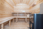 Interior of the Dundalk CT Georgian 6-Person Outdoor Cabin Sauna with benches and black heater