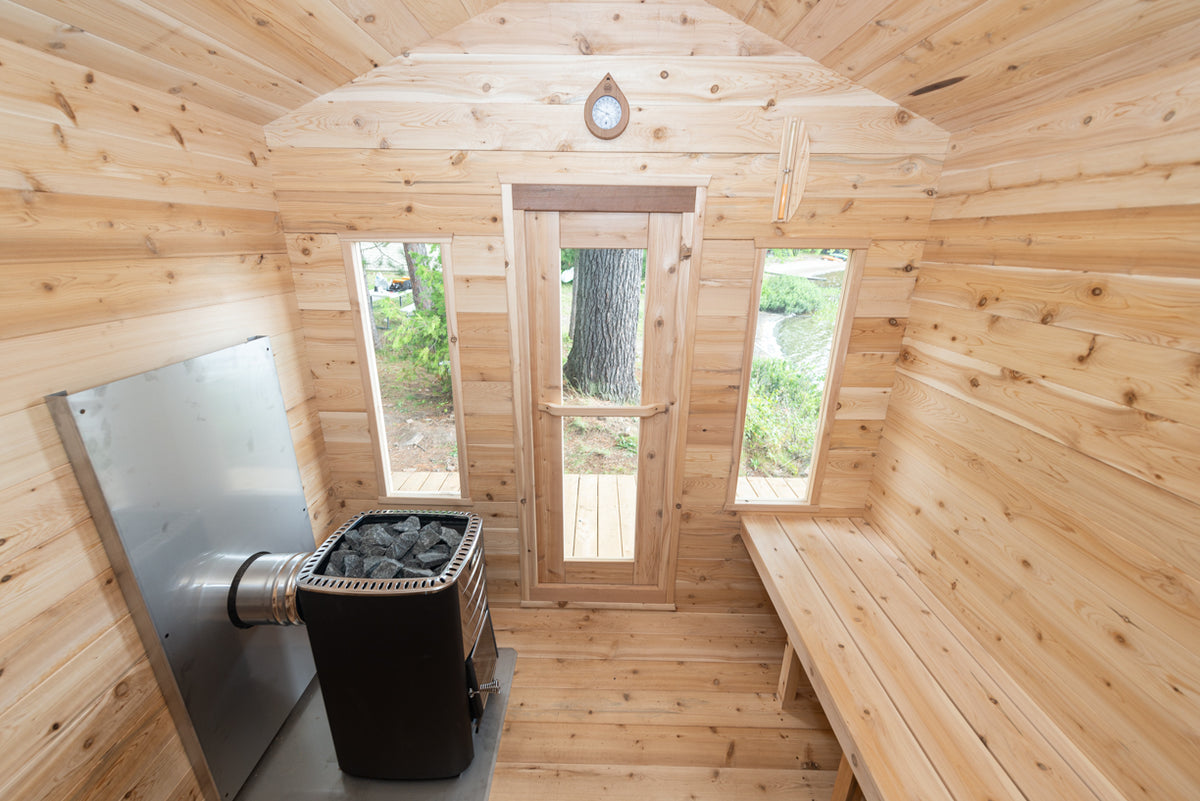 Interior of the Dundalk CT Georgian 6-Person Outdoor Cabin Sauna with narrow windows and heater