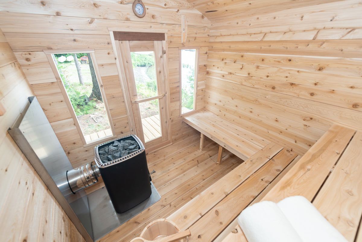 Heater and narrow windows inside the Dundalk CT Georgian 6-Person Outdoor Cabin Sauna