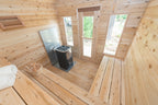 Benches, heater and windows inside the Dundalk CT Georgian 6-Person Outdoor Cabin Sauna
