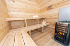 Benches and wood-burning stove inside the Dundalk CT Georgian 6-Person Outdoor Cabin Sauna