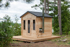 Angled view of the Dundalk CT Georgian 6-Person Outdoor Cabin Sauna on a lakeside deck