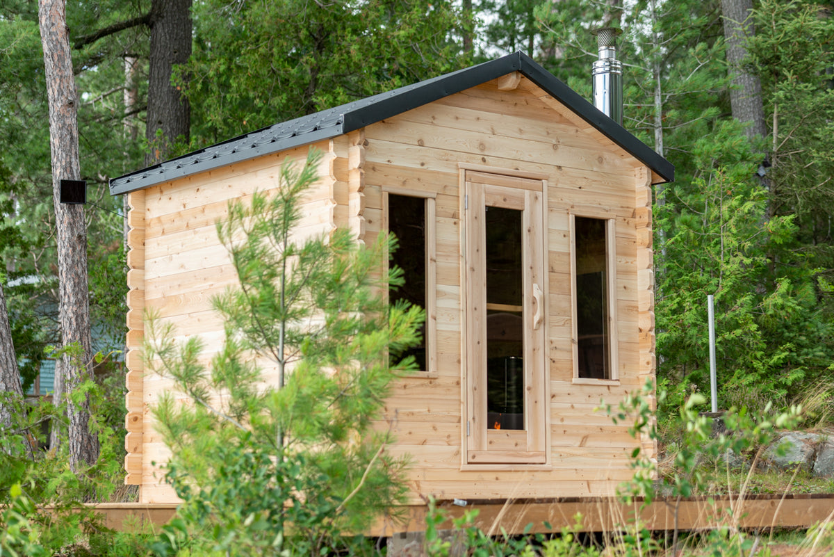 Dundalk CT Georgian 6-Person Outdoor Cabin Sauna exterior with windows in a woodland setting
