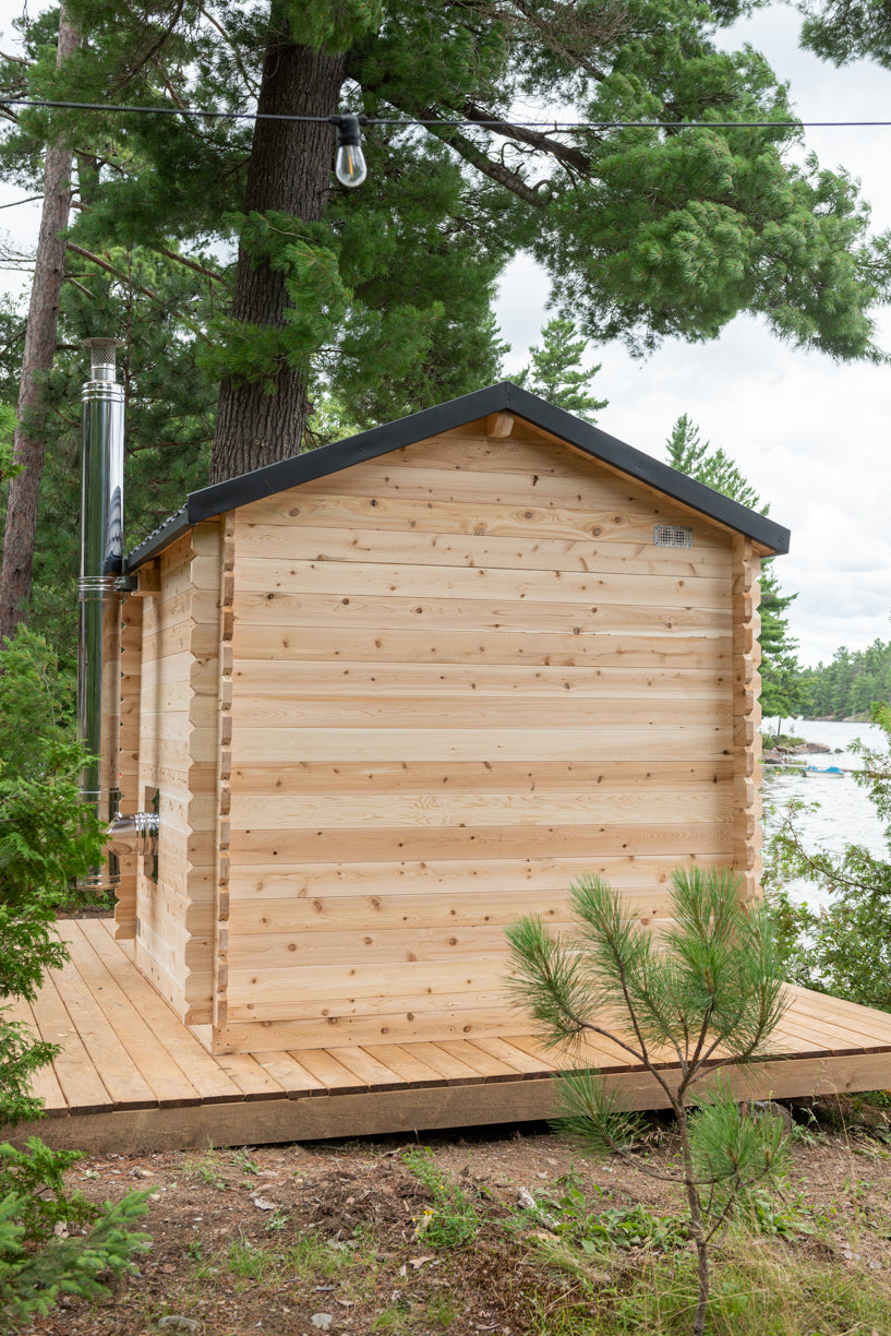 Rear view of the Dundalk CT Georgian 6-Person Outdoor Cabin Sauna on a deck