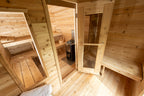 Change room with bench and door inside the Dundalk CT Georgian 6-Person Cabin Sauna with Change Room
