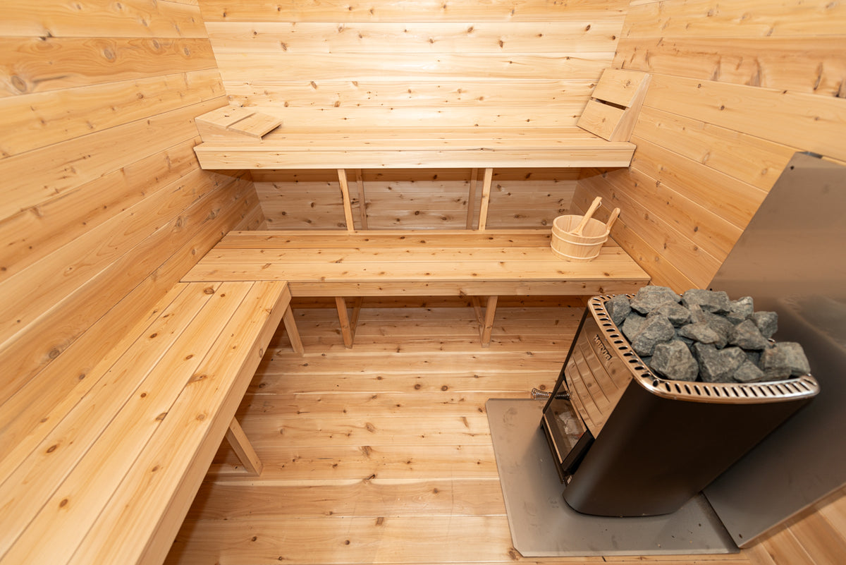 Interior of the Dundalk CT Georgian 6-Person Cabin Sauna with Change Room with benches and heater