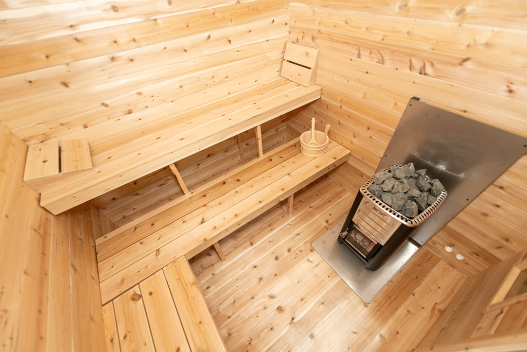 Sauna room benches and heater inside the Dundalk CT Georgian 6-Person Cabin Sauna with Change Room