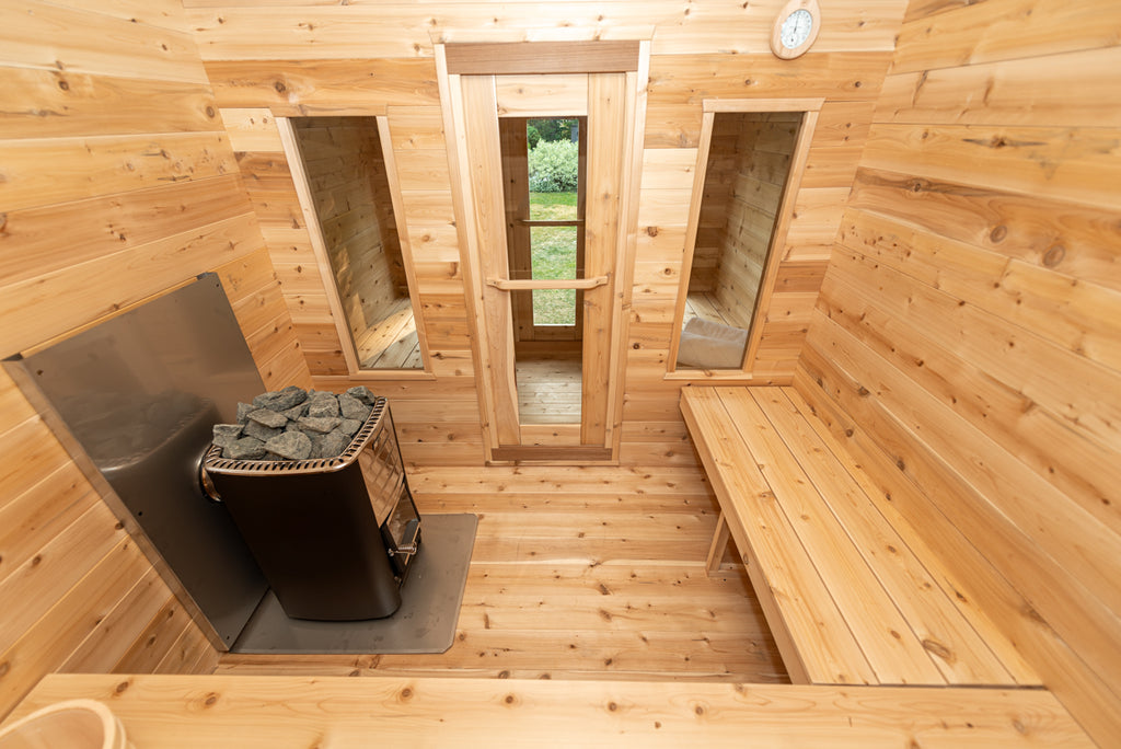 Interior of the Dundalk CT Georgian 6-Person Cabin Sauna with Change Room with benches and heater from above