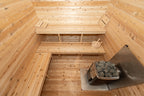 Benches and heater in the sauna room of the Dundalk CT Georgian 6-Person Cabin Sauna with Change Room