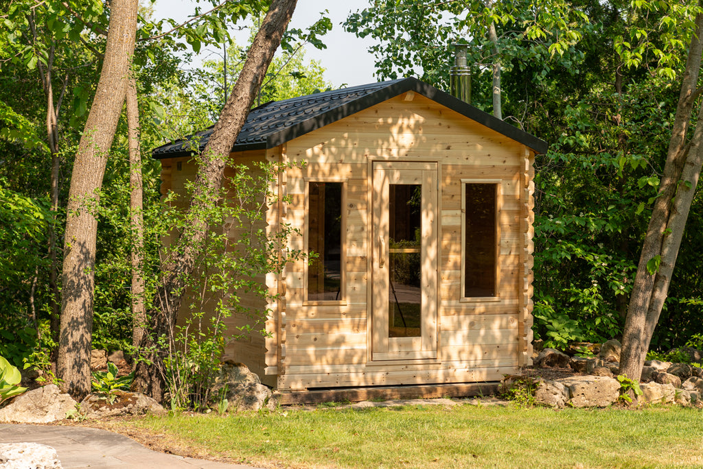 Dundalk CT Georgian 6-Person Cabin Sauna with Change Room exterior with front windows in a forest