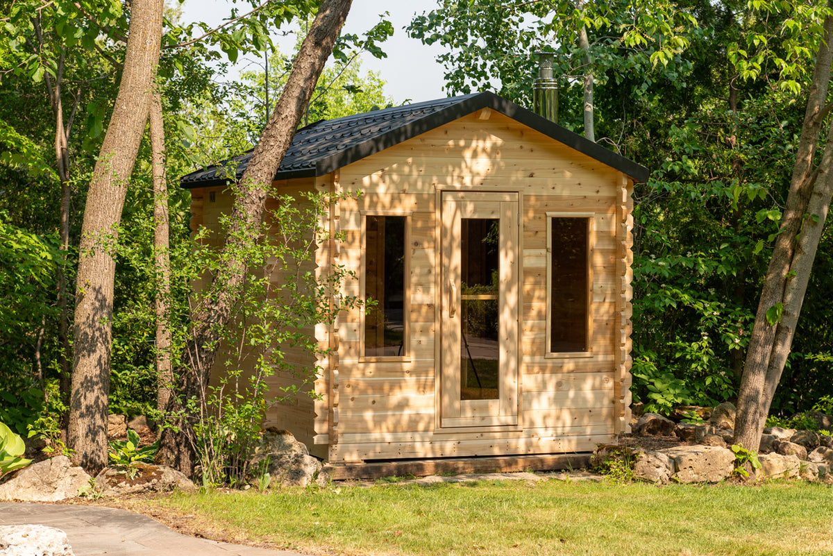 Dundalk CT Georgian 6-Person Cabin Sauna with Change Room exterior with front windows in a forest