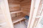 Interior of the Dundalk CT Granby 3-Person Outdoor Cabin Sauna with open door and benches